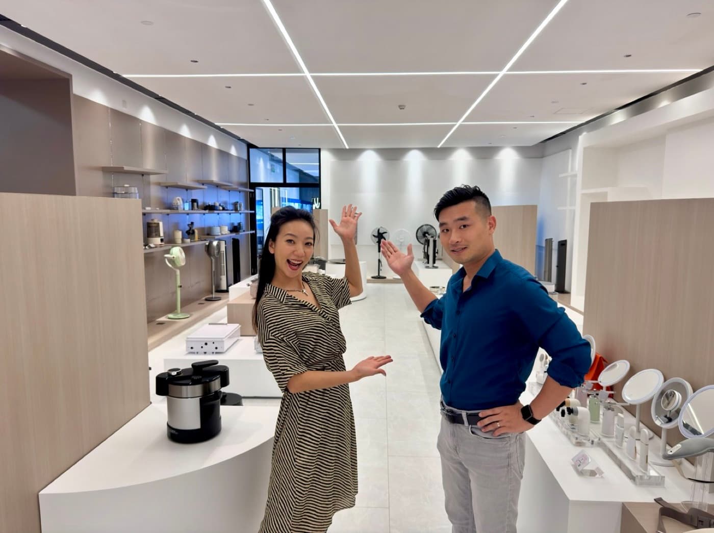 Tony and Daphne of Source with Tophney in an appliance showroom in Zhongshan